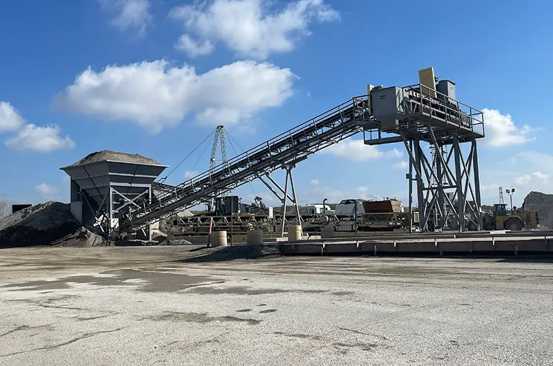 a large machine moving crushed concrete